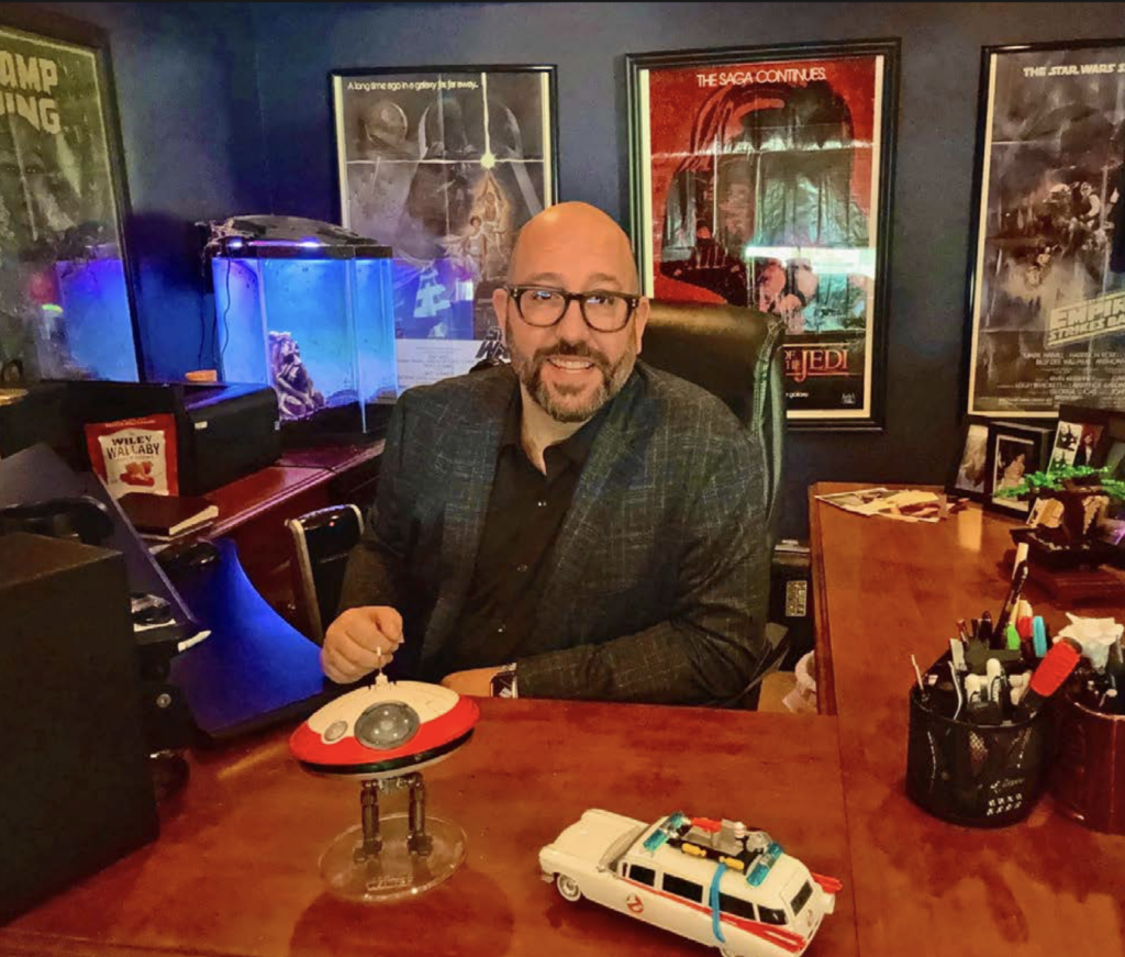 Western Film Services owner and film buyer Joe Garel in his office surrounded by film memorabilia.