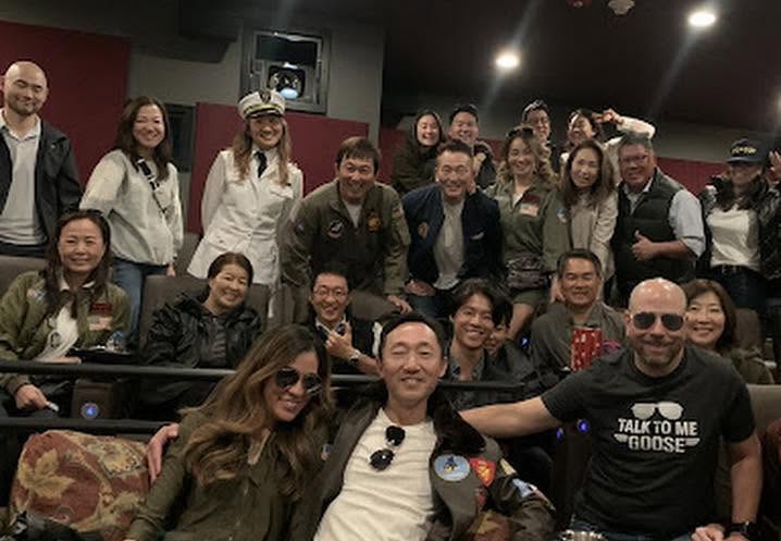 Community members gather at independent theater Big Picture Theaters in Issaquah, WA, dressed up for an event screening of Top Gun Maverick.
